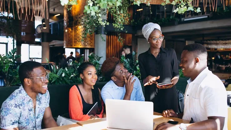 African business colleagues working in an office — an article about agritech software development in Nigeria