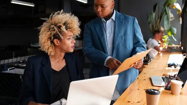 Business colleagues working in an office — an article about AI adoption strategy for Nigerian businesses