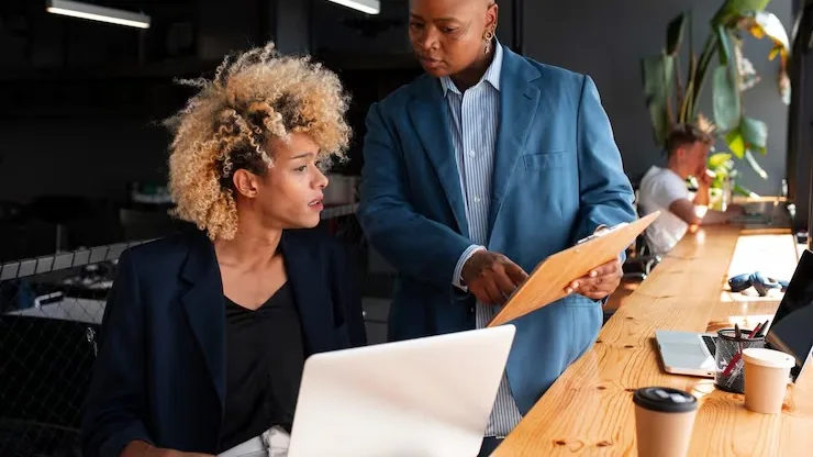 Business colleagues working in an office — an article about AI adoption strategy for Nigerian businesses