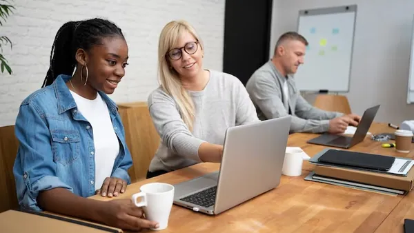 Business colleagues working in an office — an article about AI chatbots for Nigerian online stores