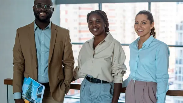 Business colleagues working in an office — an article about AI customer service for Nigerian businesses
