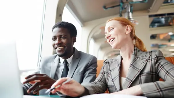 Business colleagues in a meeting in an office — an article about AI development services in Nigeria