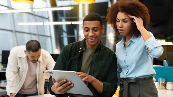 Business colleagues working in an office — an article about AI email marketing for Nigerian businesses