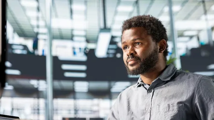 An African businessman working in an office — an article about AI for Nigerian agriculture
