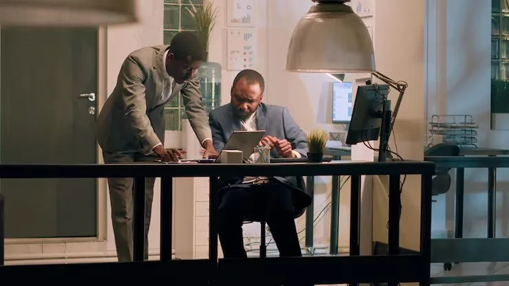 Business colleagues working in an office — an article about AI for Nigerian hospitality