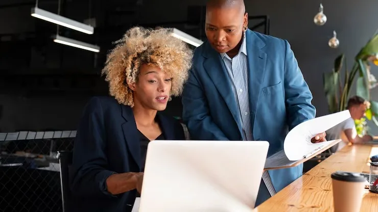 Business colleagues working in an office — an article about AI for Nigerian logistics companies