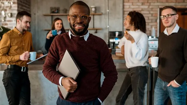 Business colleagues in a meeting in a cafe — an article about AI for Nigerian marketing agencies