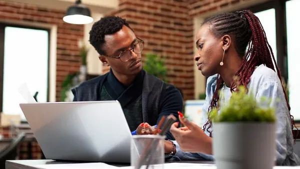 A businesswoman in a meeting in an office — an article about AI for Nigerian travel businesses