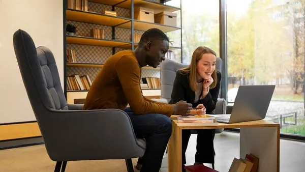 Business colleagues working in an office — an article about AI implementation cost in Nigeria