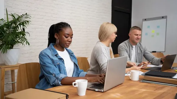 Business colleagues working in an office — an article about AI product recommendations for Nigerian e-commerce