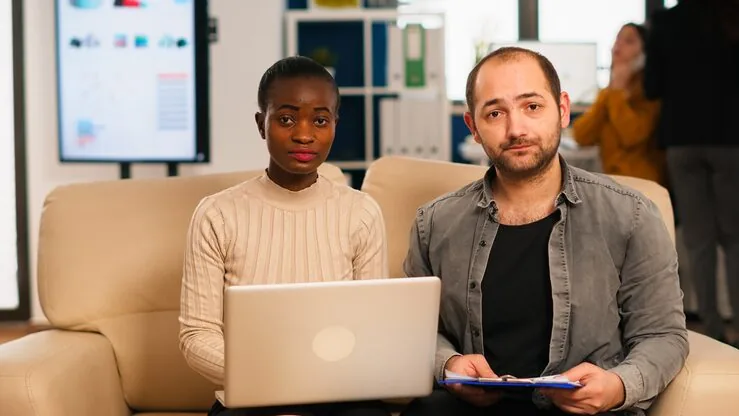 Business colleagues in a meeting at home — an article about AI recruitment software in Nigeria