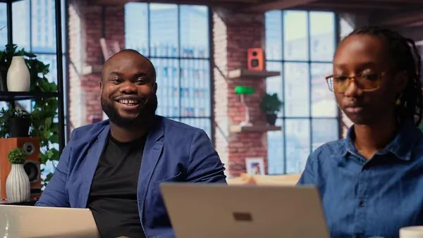 African couple working in an office — an article about inventory automation Nigeria