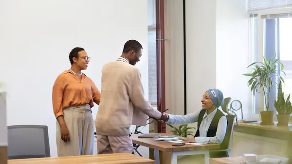 Business colleagues working in an office — an article about order automation Nigeria