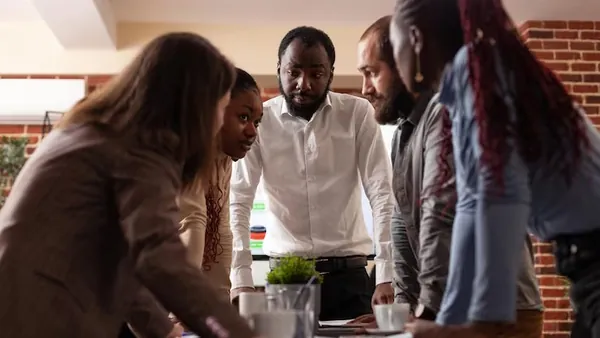 Business colleagues in a meeting over documents in an office — an article about best accounting software for Nigerian