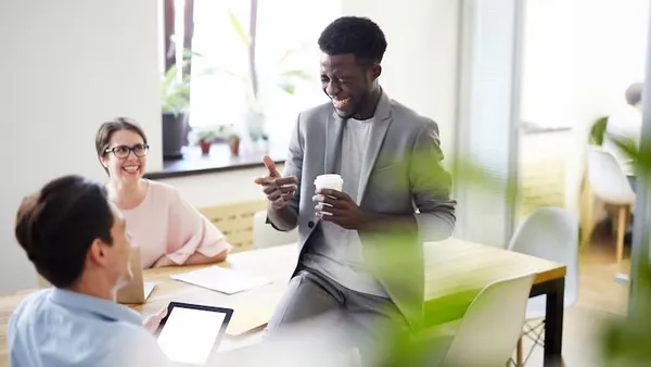 Business colleagues working in an office — an article about AI tools for schools Nigeria