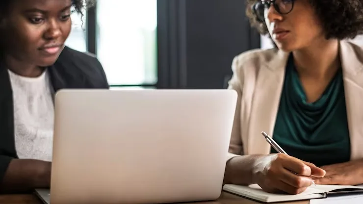 Business colleagues in a meeting in an office — an article about best CRM tools for Nigerian businesses