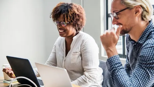 Business colleagues in a meeting in an office — an article about best e-commerce platforms in Nigeria