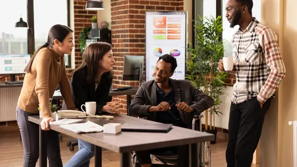 Business colleagues working in an office — an article about best e-commerce tools for Nigerian businesses