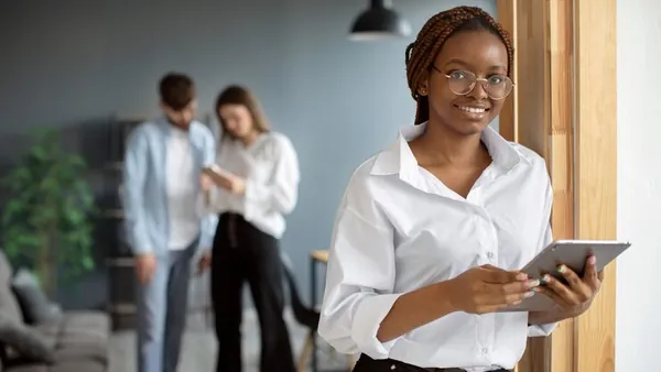 A businesswoman working in an office — an article about best online businesses to start in Nigeria