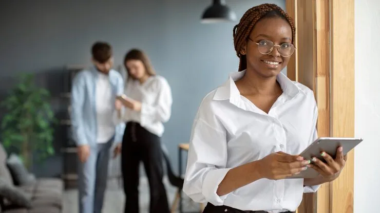 A businesswoman working in an office — an article about best online businesses to start in Nigeria