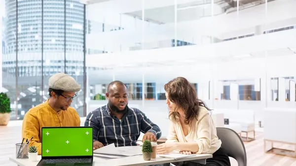 A businessman in a meeting in an office — an article about technology solutions for Nigerian real estate companies