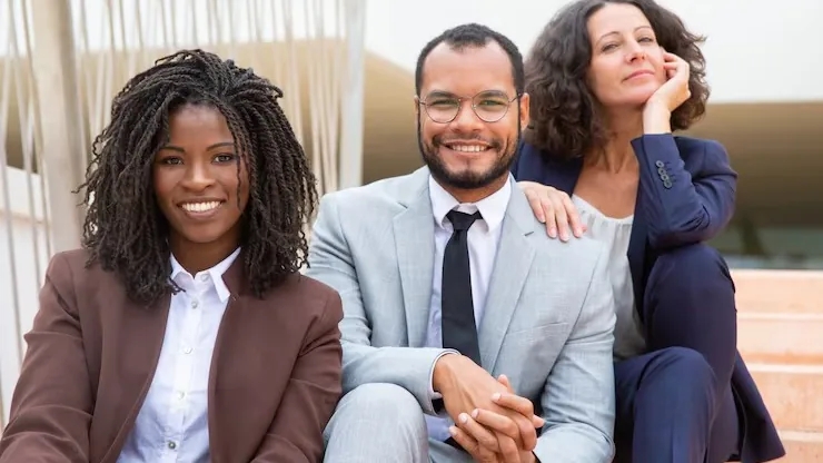 Business colleagues at work in an office — an article about build vs buy business software in Nigeria