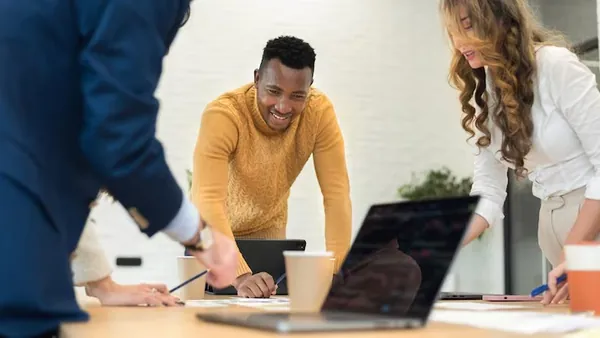 African business colleagues in a meeting in an office — an article about business software every Nigerian SME needs