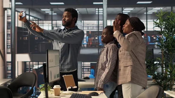 African business colleagues taking notes in an office — an article about can AI replace employees in Nigeria