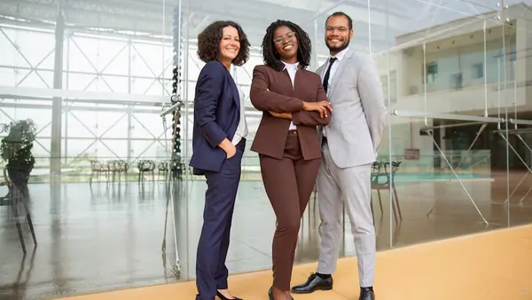 Business colleagues working in an office — an article about custom business software development in Nigeria