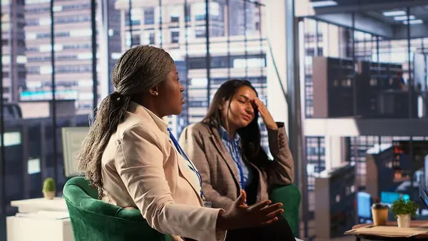 A businesswoman working in an office — an article about digital payments e-commerce Nigeria