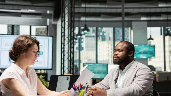A manager in a meeting in an office — an article about digital tools every Nigerian SME needs