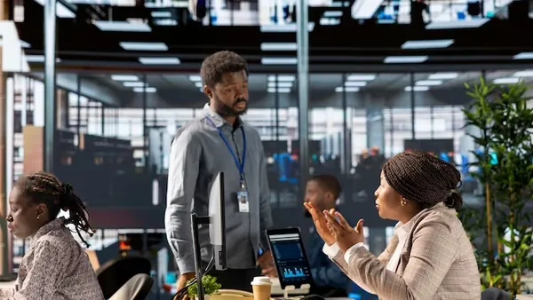 A businesswoman working in an office — an article about digital transformation for Nigerian startups