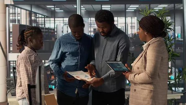African business colleagues planning in an office — an article about digital transformation strategy for Nigerian businesses
