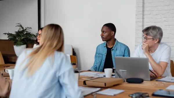 Business colleagues working in an office — an article about e-commerce business ideas for Nigeria