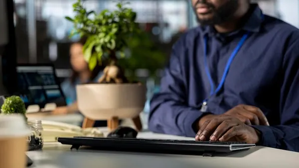 A businessman reviewing over documents in an office — an article about e-commerce KPIs for Nigerian businesses