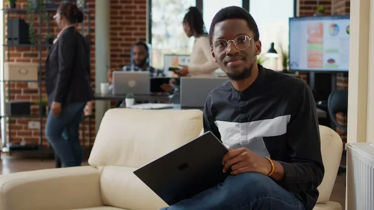 A businessman in a meeting on a laptop in an office — an article about e-commerce SEO checklist Nigeria