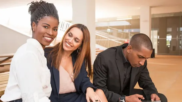 A businesswoman on a call on a phone in an office — an article about fashion app development in Nigeria