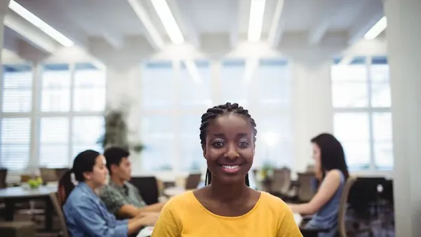 Business colleagues working in an office — an article about fashion website design in Nigeria