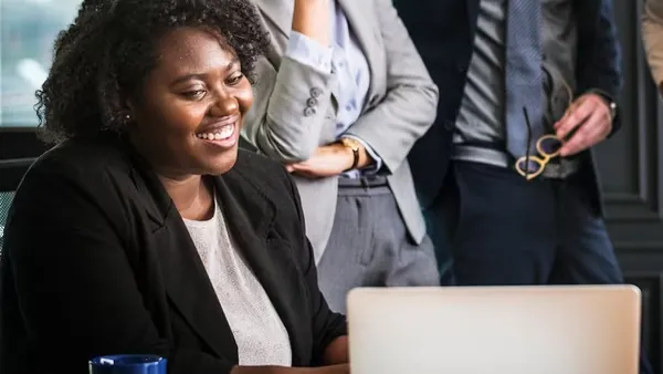 Business colleagues in a meeting in an office — an article about Flutter app development in Nigeria