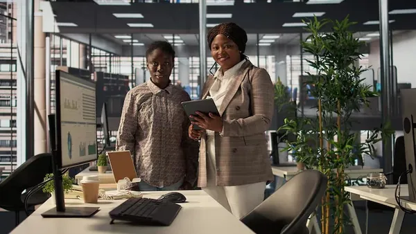 Business colleagues working in an office — an article about future of e-commerce in Nigeria