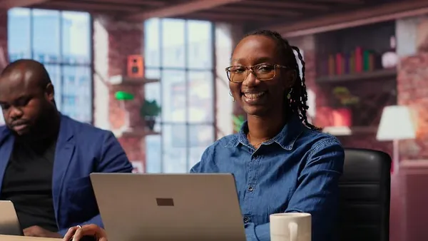 An African businesswoman reviewing over documents in an office — an article about Google Search Console for Nigerian
