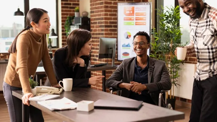 Business colleagues working in an office — an article about hospital app development Nigeria