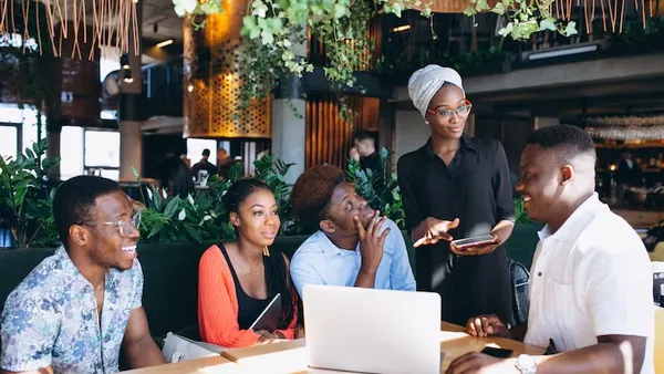 African business colleagues working in an office — an article about hospital management software Nigeria