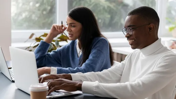 Business colleagues working in an office — how AI can help Nigerian businesses get more customers