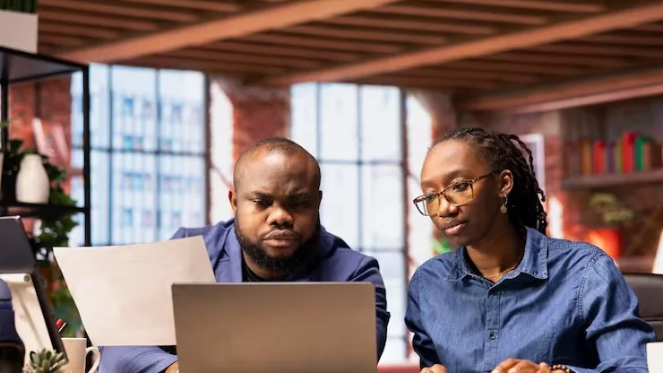 African couple at home — how AI can help Nigerian SMEs reduce costs