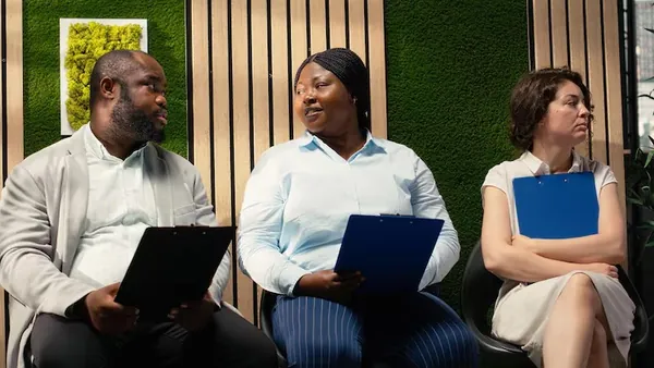 Business colleagues in a meeting in an office — how AI can help small businesses in Nigeria