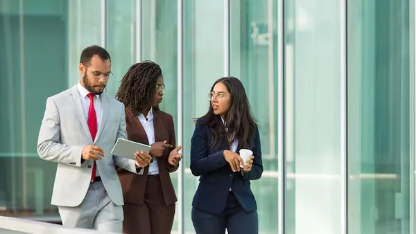 Business colleagues working in an office — how automation increases business productivity