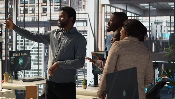 African business colleagues working in an office — how long does it take to build a website in Nigeria