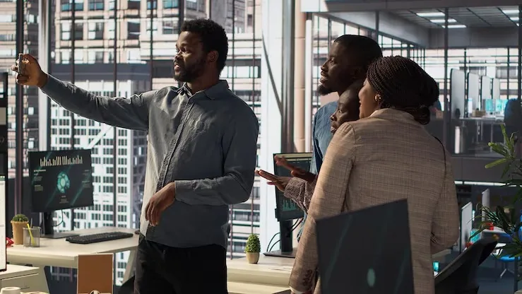 African business colleagues working in an office — how long does it take to build an app in Nigeria