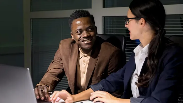 Business colleagues working in an office — how many pages does a business website need